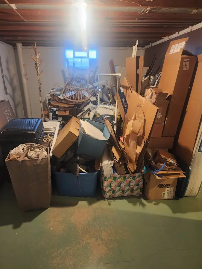 Roll-off dumpster container at job site for 2 Yard Dumpster Rental in Woodfin